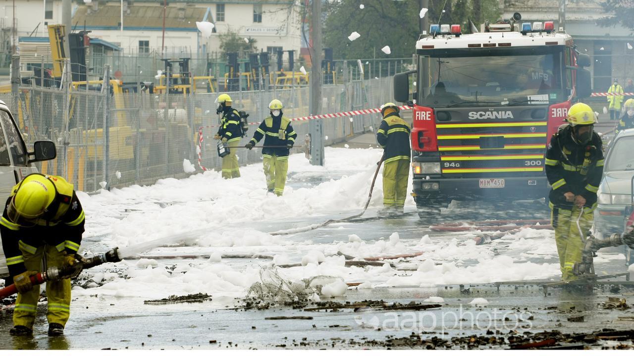 Fire crews spray foam (file image)