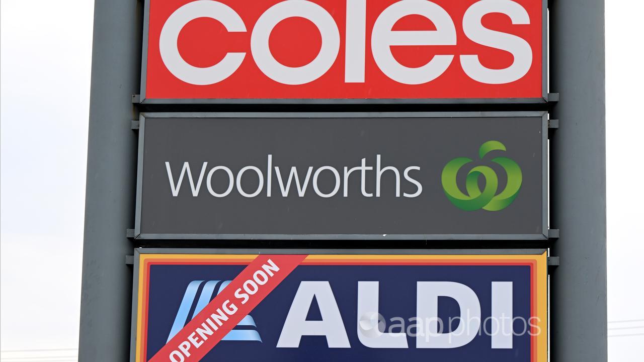 Coles, Woolworths, Aldi signs