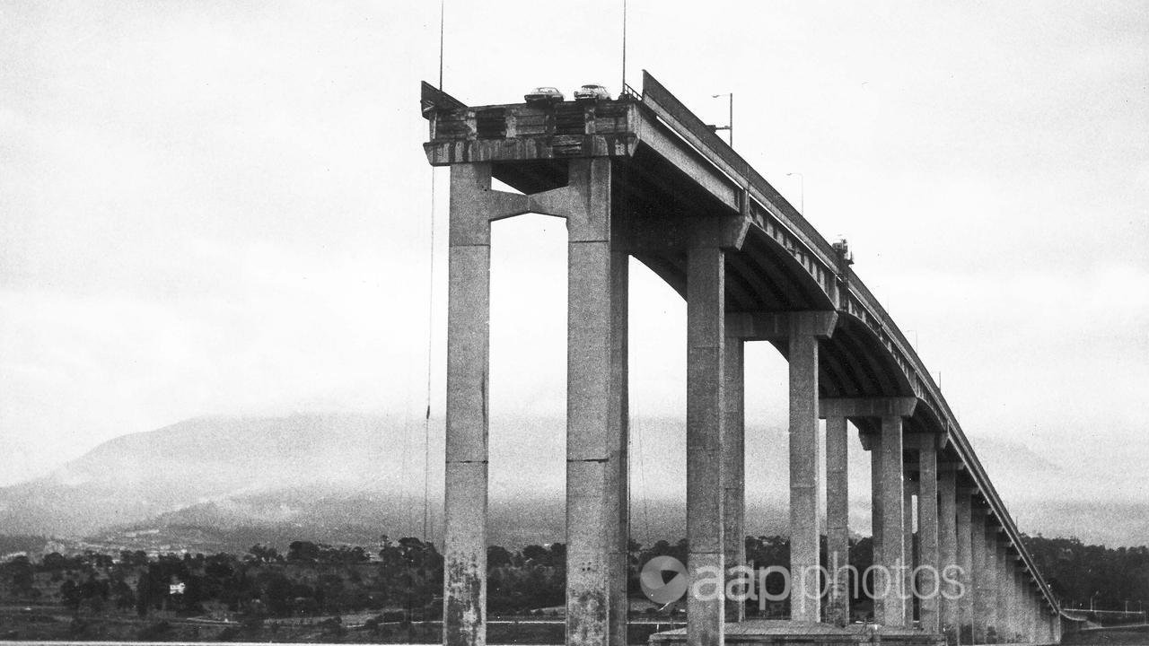 Two cars hang over the edge of the Tasman Bridge