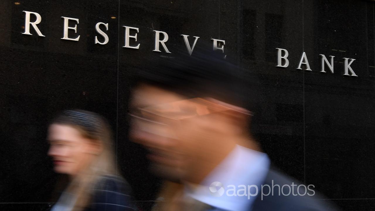 Pedestrians walk past the Reserve Bank of Australia (file)