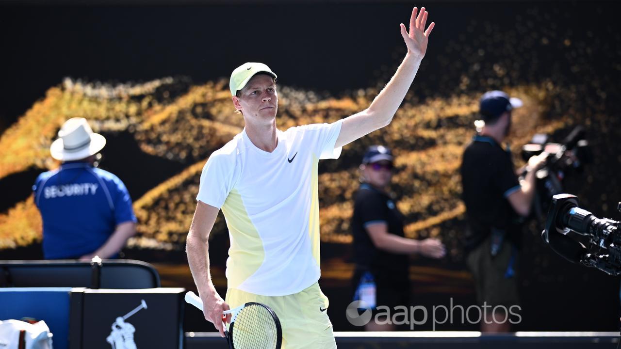 Jannik Sinner waves to crowd