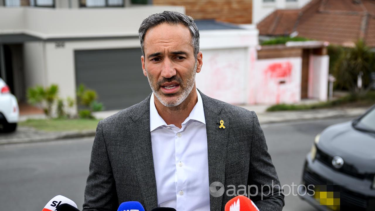 Alex Ryvchin speaks to media outside his former family home