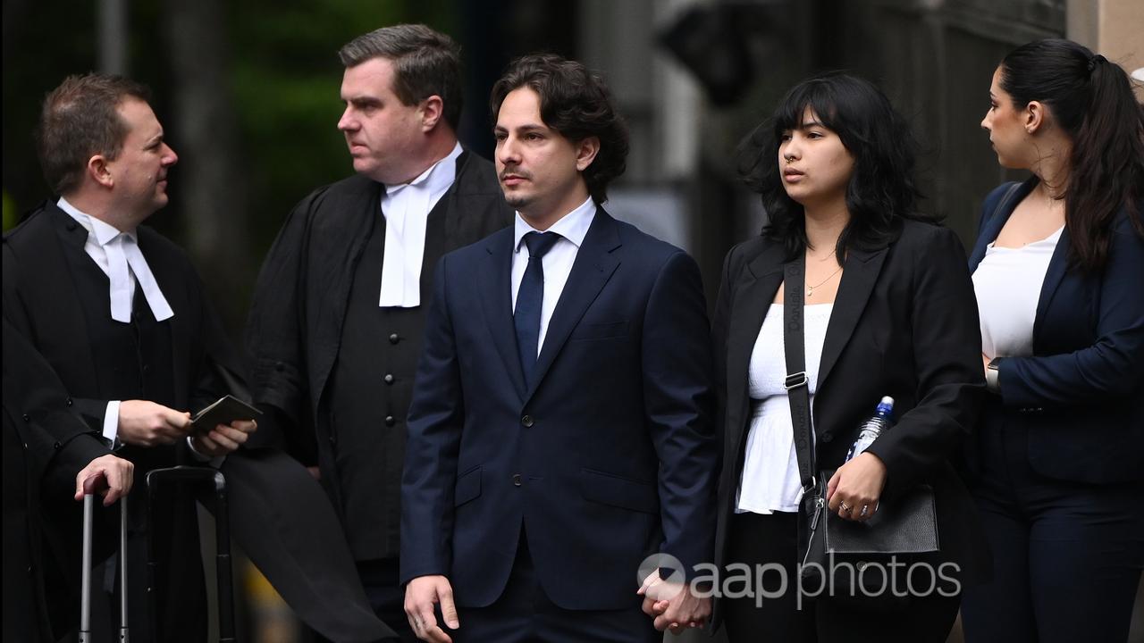 Christopher Joannidis (centre) with lawyers